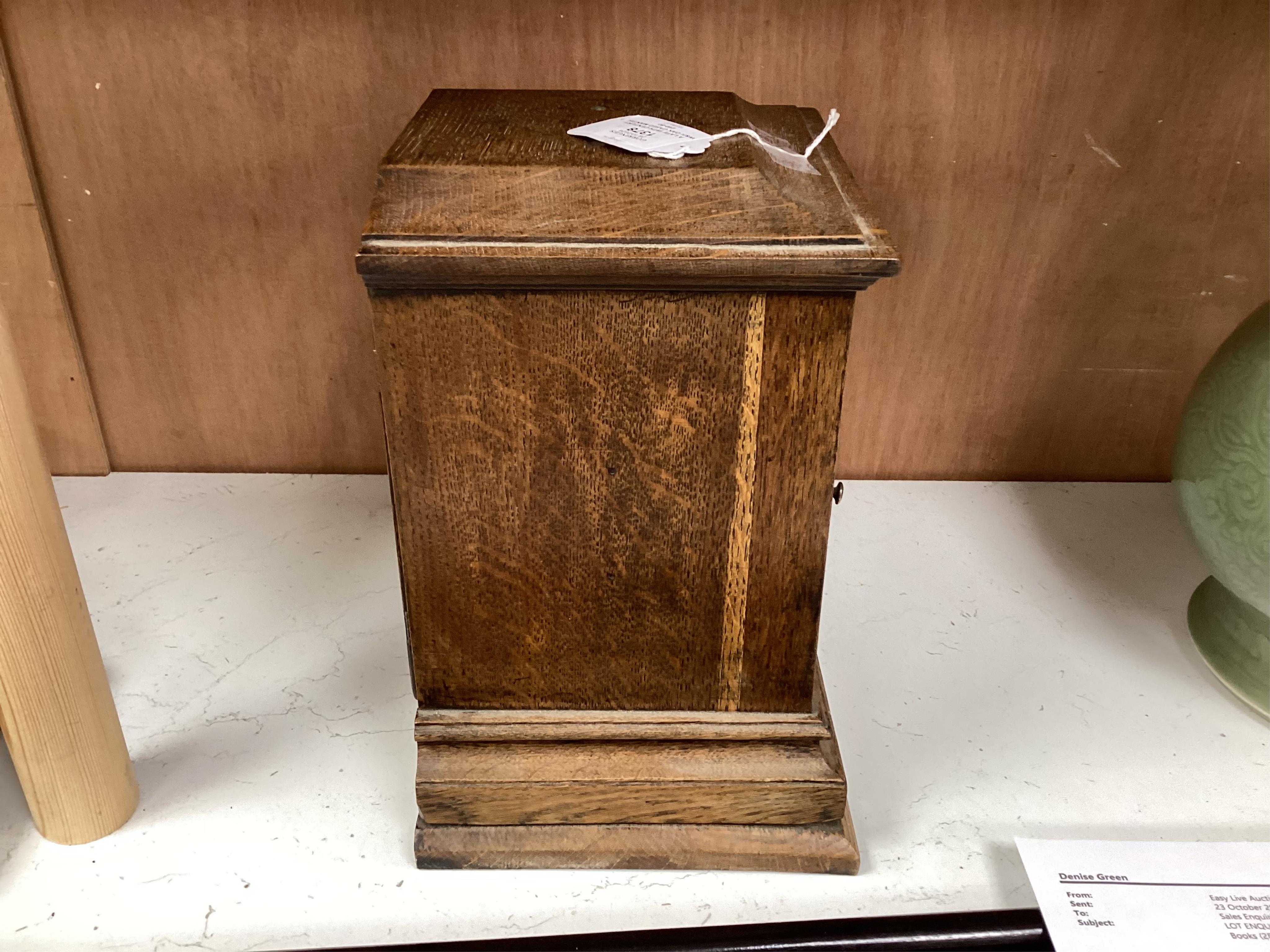 A late 19th century W&H oak cased mantel clock, chiming and striking on two coiled gongs, 27cm high. Condition - fair to good, missing the handle to the top